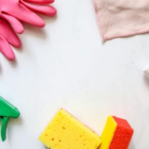 A flat lay of assorted cleaning supplies, perfect for housekeeping themes.